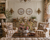  English Country living room with plaid chairs, floral arrangements, and ornate decor. Mintons polychrome brown transferware