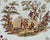 Close-up of Victorian garden scene with figures and ladder on antique Minton platter