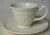 Vintage  CreamWare Cream Ware Demitasse Cup and Saucer  w/ Embossed Urns and Floral Scrolls Border